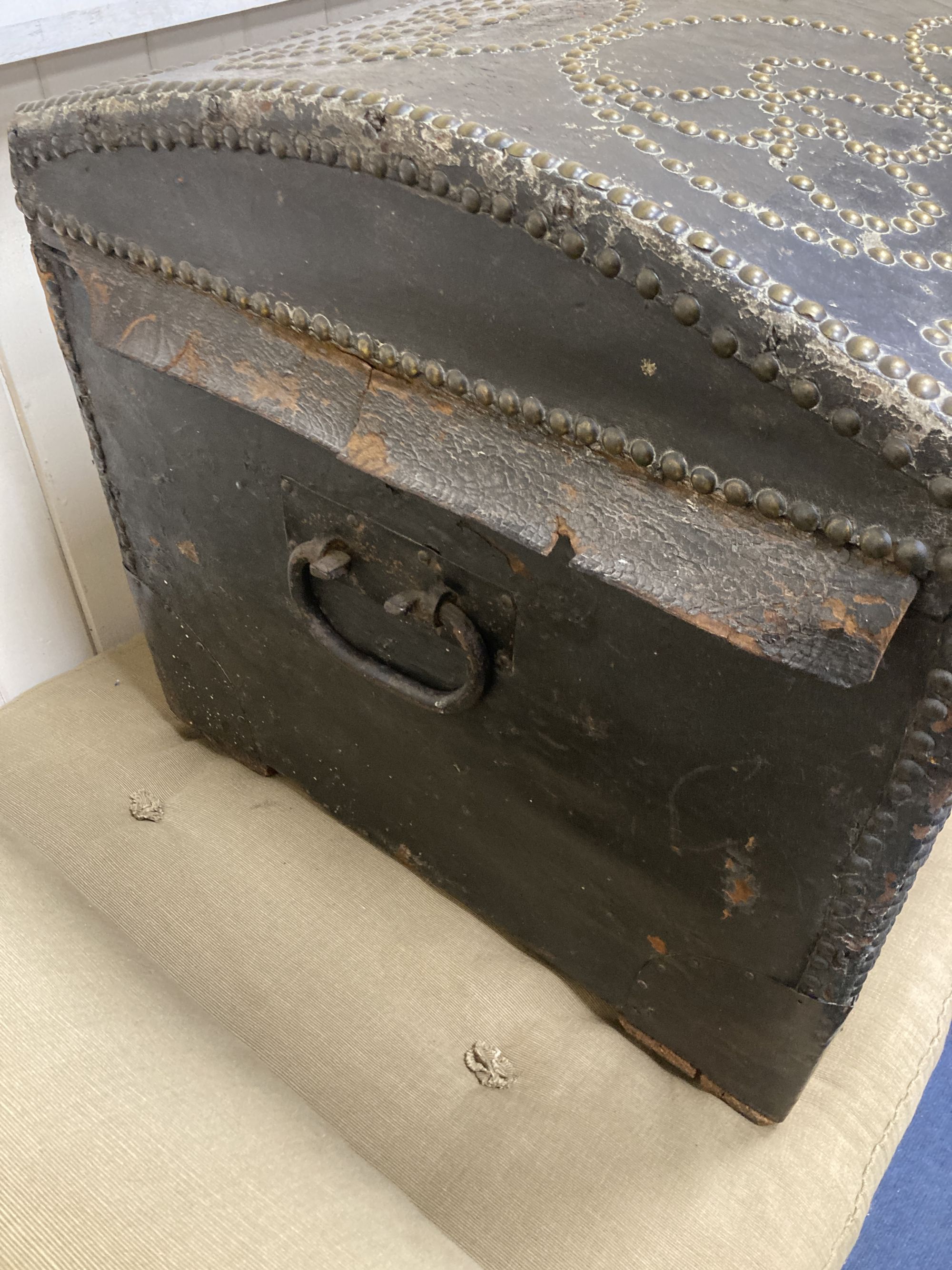 An 18th century Dutch brass mounted and studded leather covered domed top trunk, length 116cm, depth 50cm, height 48cm